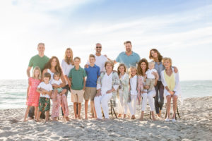photos on the beach, multiple generations, large group